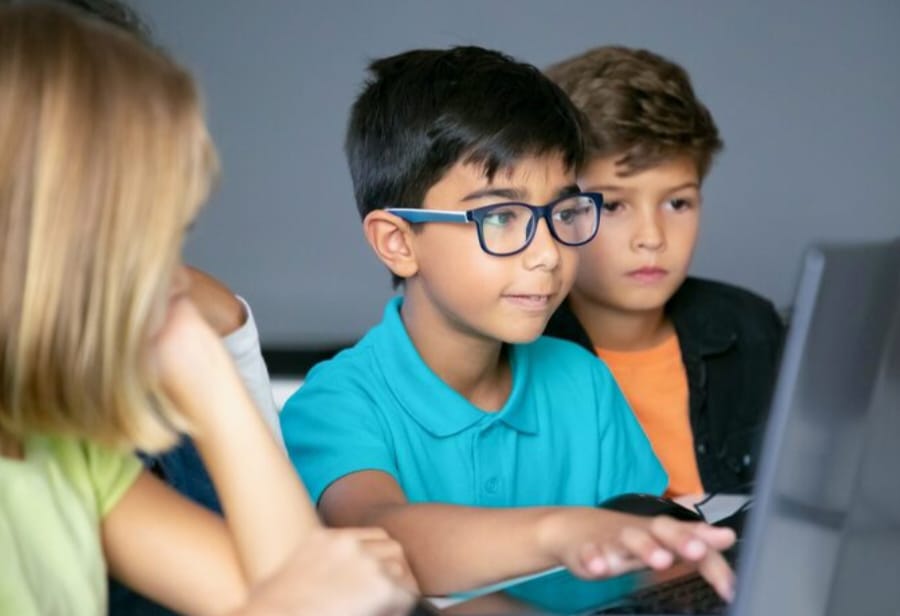 Kids using laptop for coding