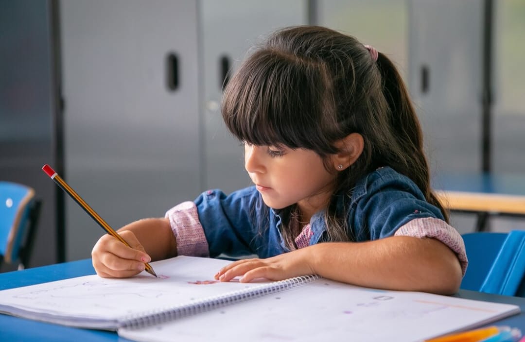 Girl writing in notebook